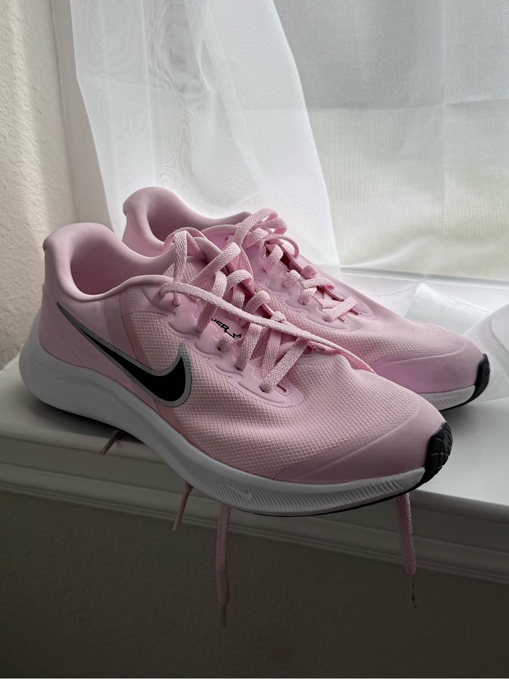 Nike Women's Pink Athletic Running Shoes with Black Swoosh